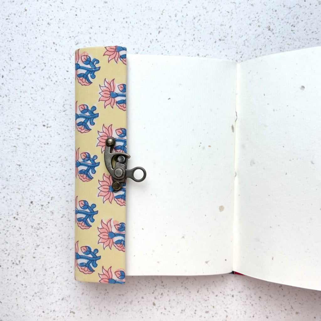 Yellow Lotus lock diary opened to show handmade paper pages