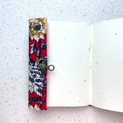 Red Floral lock diary opened to show handmade paper pages