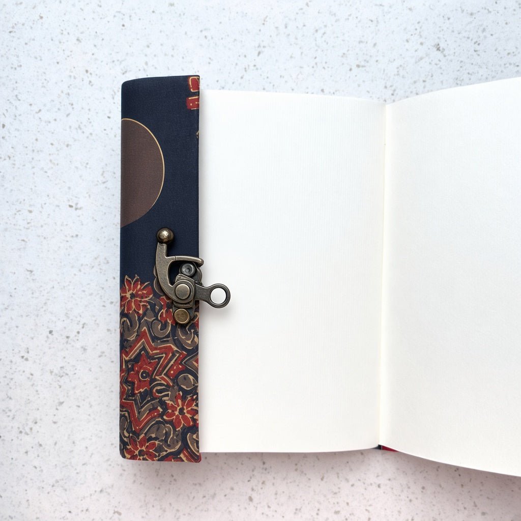 Navy Medallion lock diary opened to show handmade paper pages