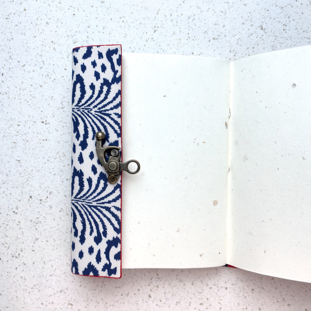 Navy Ikat lock diary opened to show handmade paper pages