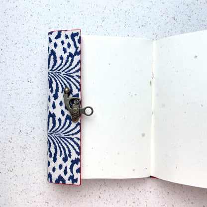 Navy Ikat lock diary opened to show handmade paper pages