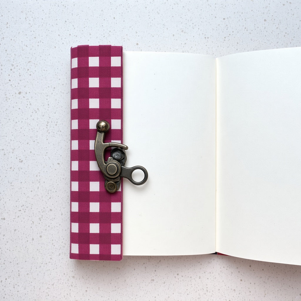 Pink Check lock diary opened to show handmade paper pages
