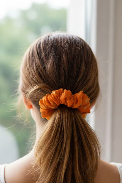Orange Embroidered scrunchie worn in hair